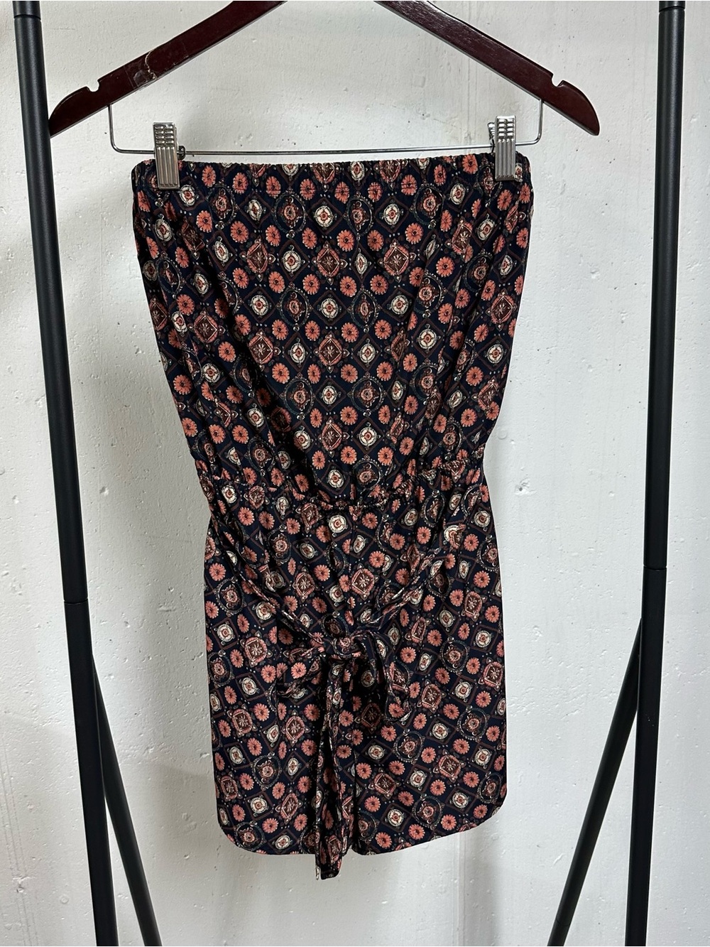 Romeo & Juliet Couture Black Sleeveless Romper with Coral Floral Medallion